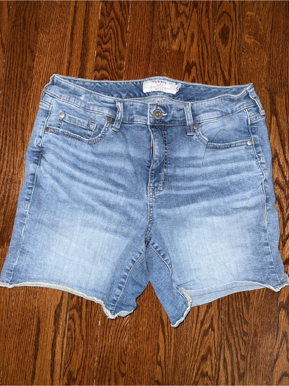 torrid light wash denim cutoff Bermuda shorts